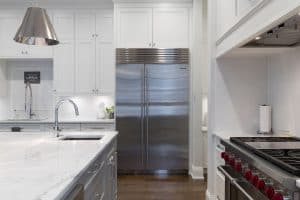 Stainless steel refrigerator in kitchen
